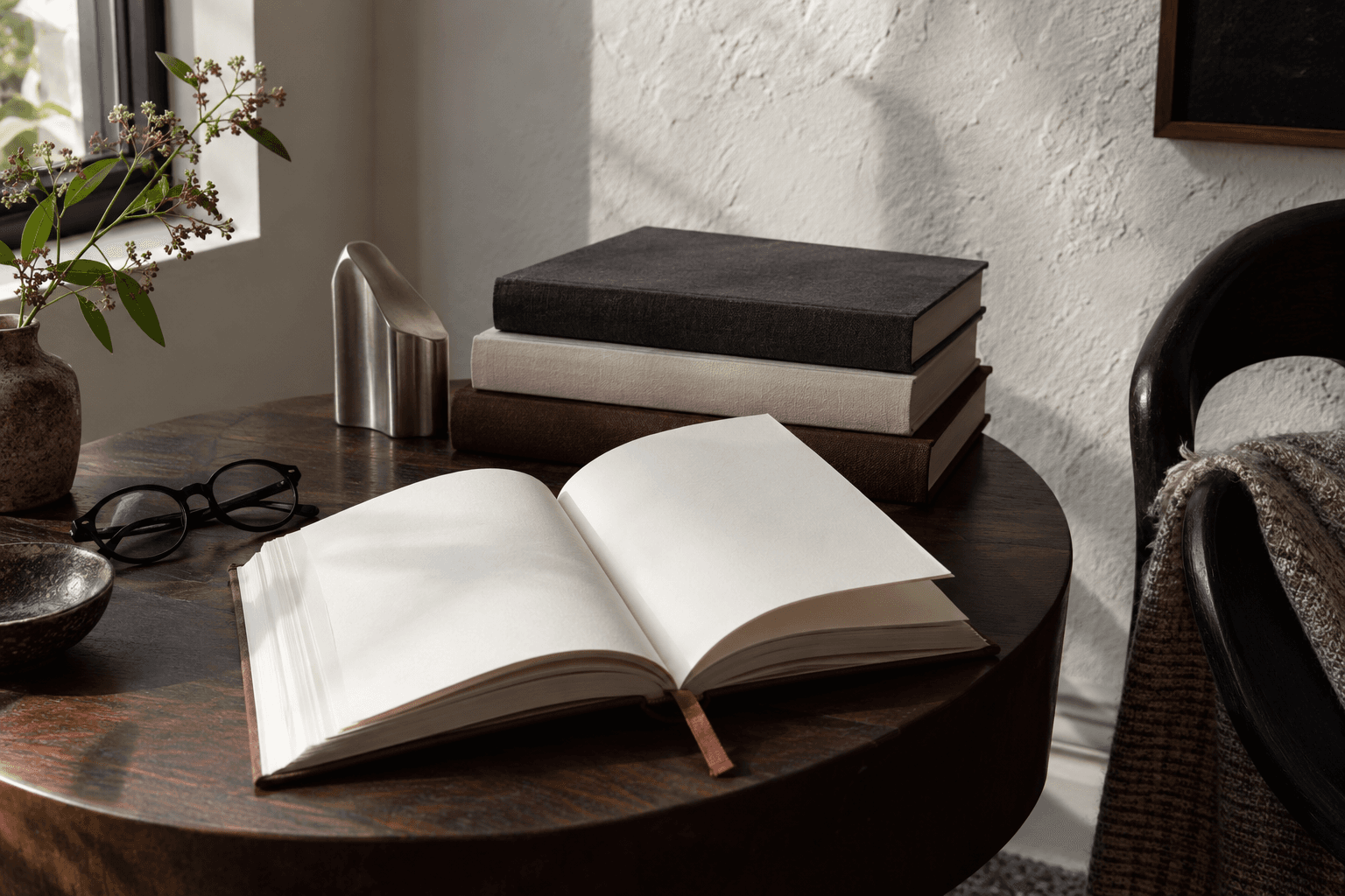 Conceptual AI image of an open blank book and stacked unbranded books on a dark walnut table beside a window; all props are fictional and unbranded.