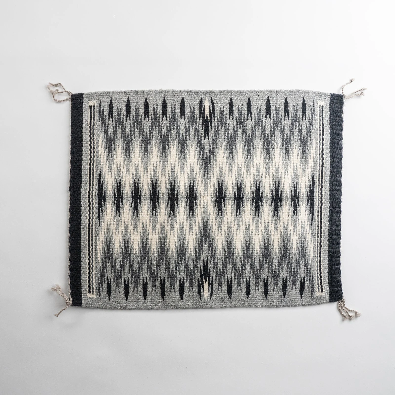 Grey "Diamond Pattern Eye Dazzler" Navajo weaving, by Ivan Catron by Karen Domenici.