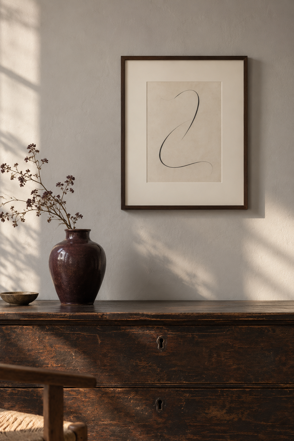 An AI-generated room study shows a small abstract drawing in an ivory mount and walnut frame above a dark chest.
